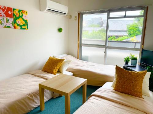 Toyonaka Apartment | Sakura202 伊丹空港アクセス抜群ペット宿泊可能 最寄駅から徒歩10分以内 都心からのアクセス抜群タイニールーム最大3名宿泊可能