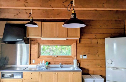 Yawatano House | A log cabin vacation rental nestled on a hill in I/Ito City Shizuoka