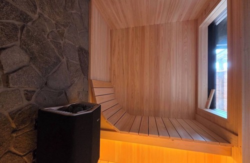 Hakone House | A vacation rental featuring a terrace, garden, and sauna—the entire house is yours! With Mt. Daimonji right before your eyes, take some time to relax in the spacious bus sauna.