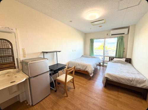 Kin Hostel | ハイ沖縄金武店トイレお風呂共用 プレオープン中駐車場有 ペット同伴可能長期滞在可能2025年10月より車貸し出しサービス有希望であればお申し付けください