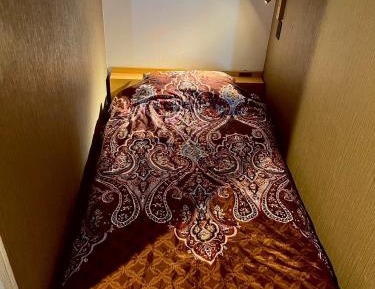 Single Bed in Dormitory Room