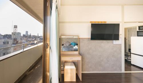 Three-Bedroom Apartment with Balcony
