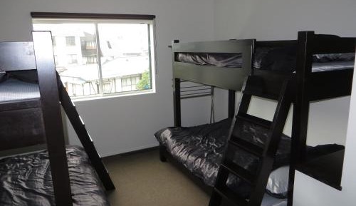 Room with Bunk Beds and Shared Bathroom 